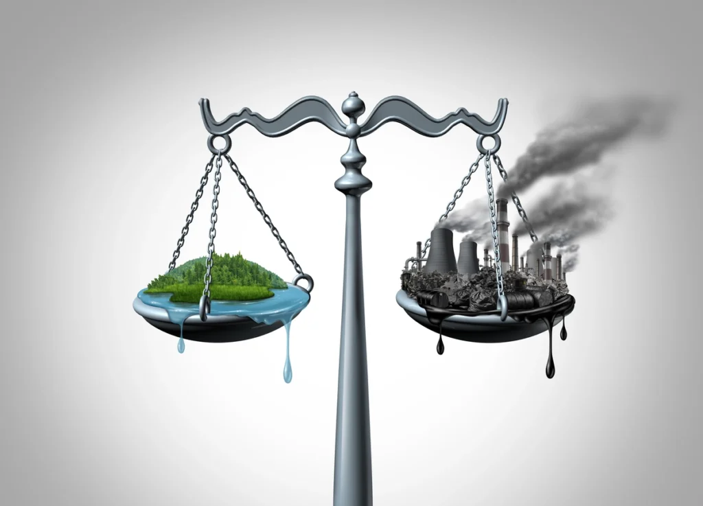 justice scale with land on the left and pollution on the right